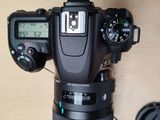 a camera that is sitting on a table next to a mouse