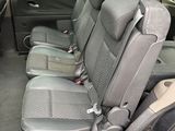 the back seats of a car are empty in a parking lot