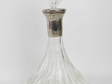 an image of a clear glass perfume bottle on a white background