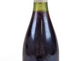 a bottle of wine that is sitting on a table