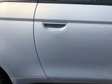 a car that has been painted silver with a sticker on it