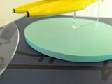 a yellow banana sitting on top of a blue plate