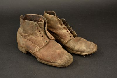 a close up of a pair of shoes on a black surface