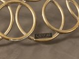 a close up of a bunch of rings on a table