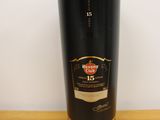 an image of a bottle of whisky sitting on top of a wooden table
