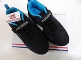 pair of black and blue shoes with a tag on top of a box