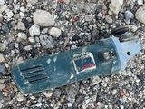 a broken tool laying on the ground on the ground