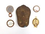several pieces of jewelry sitting on top of a table next to each other