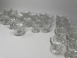 a lot of empty wine glasses on the table