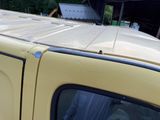 a yellow truck parked in front of a building
