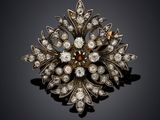 an antique diamond and gold broochle