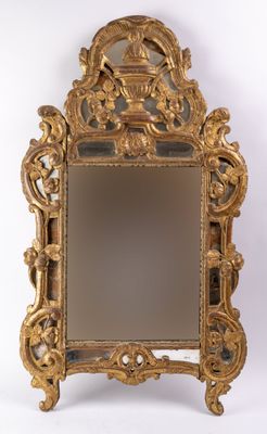 an image of a gold mirror on a stand with a white background