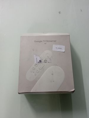 a box with a remote control on it on a table