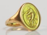 an image of a gold signet ring with a man and a woman on it