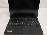 a black laptop with a red and green sticker on it