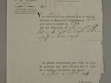 an old document with writing on it sitting on top of a table