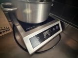a large metal bowl on top of a digital scale