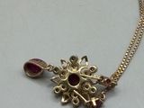 gold plated necklace with garnett and ruby stones