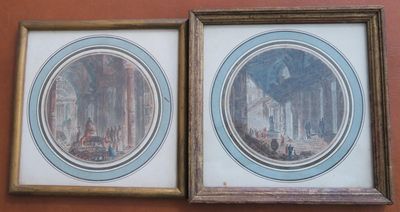two framed pictures of a painting of a church and a building