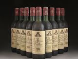 several bottles of wine are lined up in a row