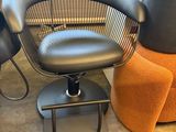 two chairs and a stool in a room