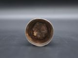 a close up of a cup sitting on top of a table
