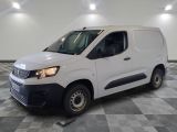 the white van is parked on a checkered floor in a room
