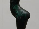 a statue of a woman that is sitting on a table