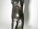 statue of a woman holding a baby in her arms on a black base