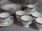 a lot of cups and saucers on the table