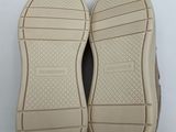 the soles of a pair of shoes on a white surface