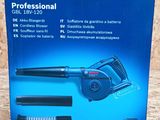 a box of bosch professional brush and blower on a wooden surface