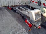 a truck with a flat bed attached to the back of it