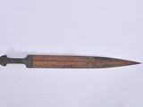 a picture of an old knife on a white surface