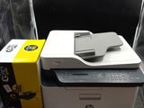 a printer sitting on top of a desk next to a box