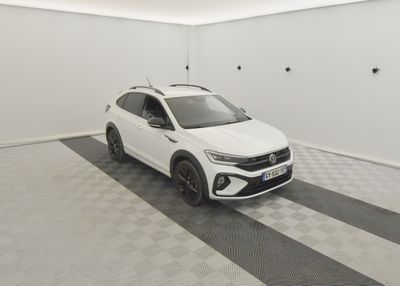 the white car is parked in the garage of the house