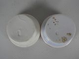 a white container with a white lid and a white container with a white lid