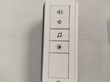 a remote control on the wall next to a remote control