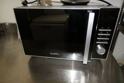 a microwave that is sitting on a counter in a kitchen