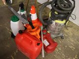 a red canister and a black canister on the floor