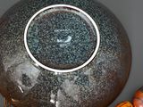 an image of a vase with a black and white design on it