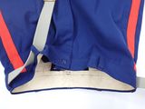 a blue and red jacket with a red stripe on it