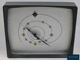 a black and white clock with a star design on it