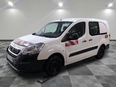 the white van is parked on a checkered floor in a room