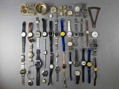 a lot of watches that are sitting on a table
