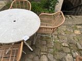 a table and chairs that are outside on the patio