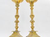 pair of antique brass candlesticks with ornate design