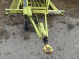 a yellow trailer that is sitting in the dirt