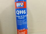 a close up of a spray can of cleaner on a table