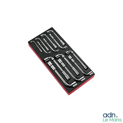 a close up of a set of tools in a box on a white surface